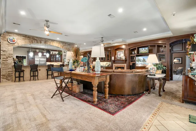 a living room with lots of furniture and a table