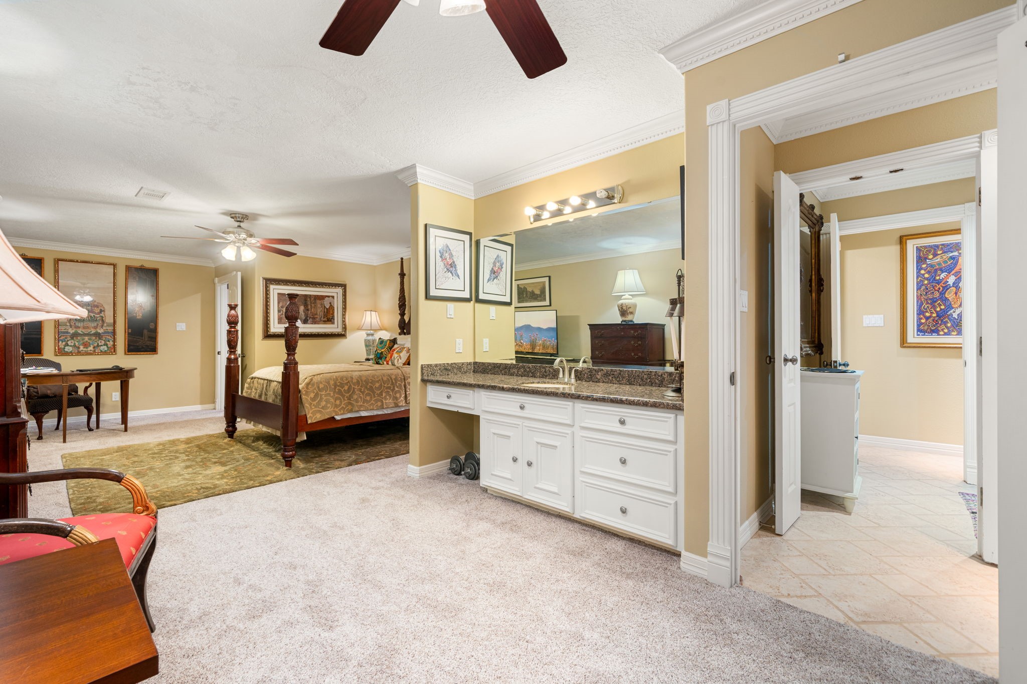 3519 Singleton Road Baytown, TX 77521 - Photo 32 of 46 a large bedroom with a bed and a chandelier