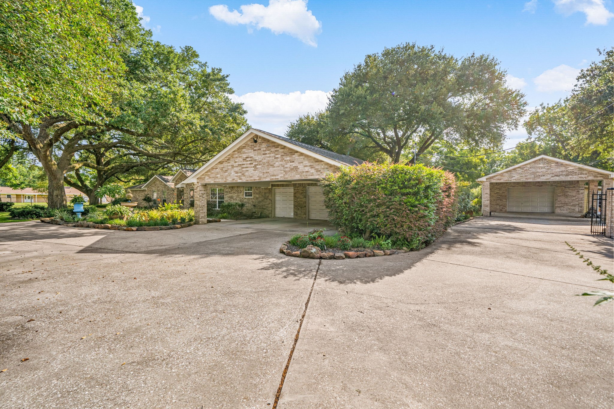 3519 Singleton Road Baytown, TX 77521 - Photo 42 of 46 a front view of a house with a yard and potted plants