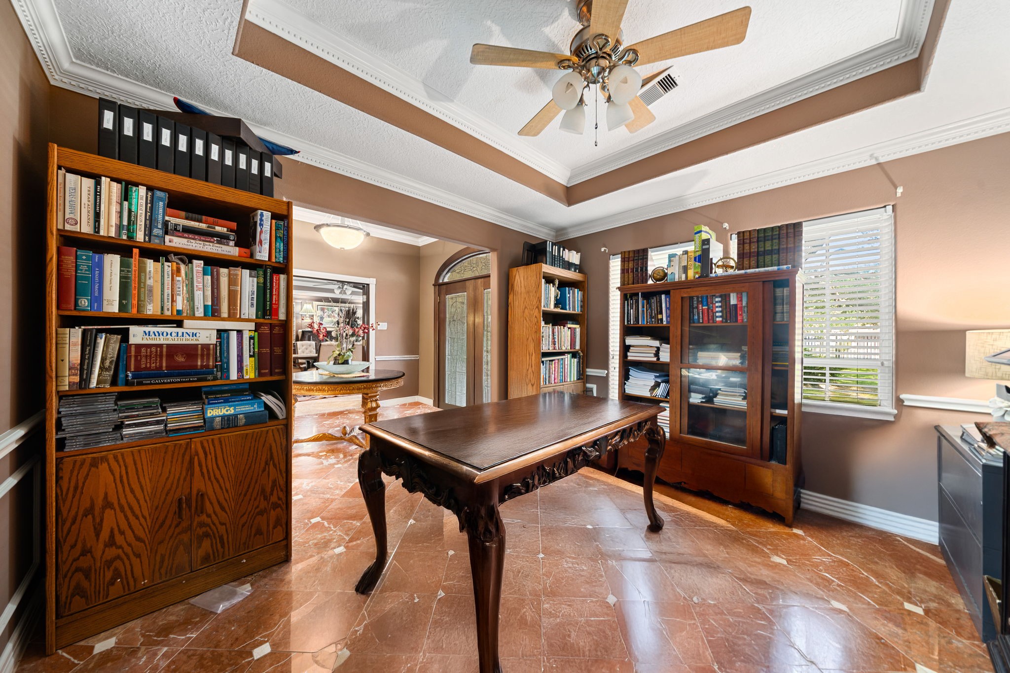 3519 Singleton Road Baytown, TX 77521 - Photo 8 of 46 a living room with furniture a bookshelf and a window