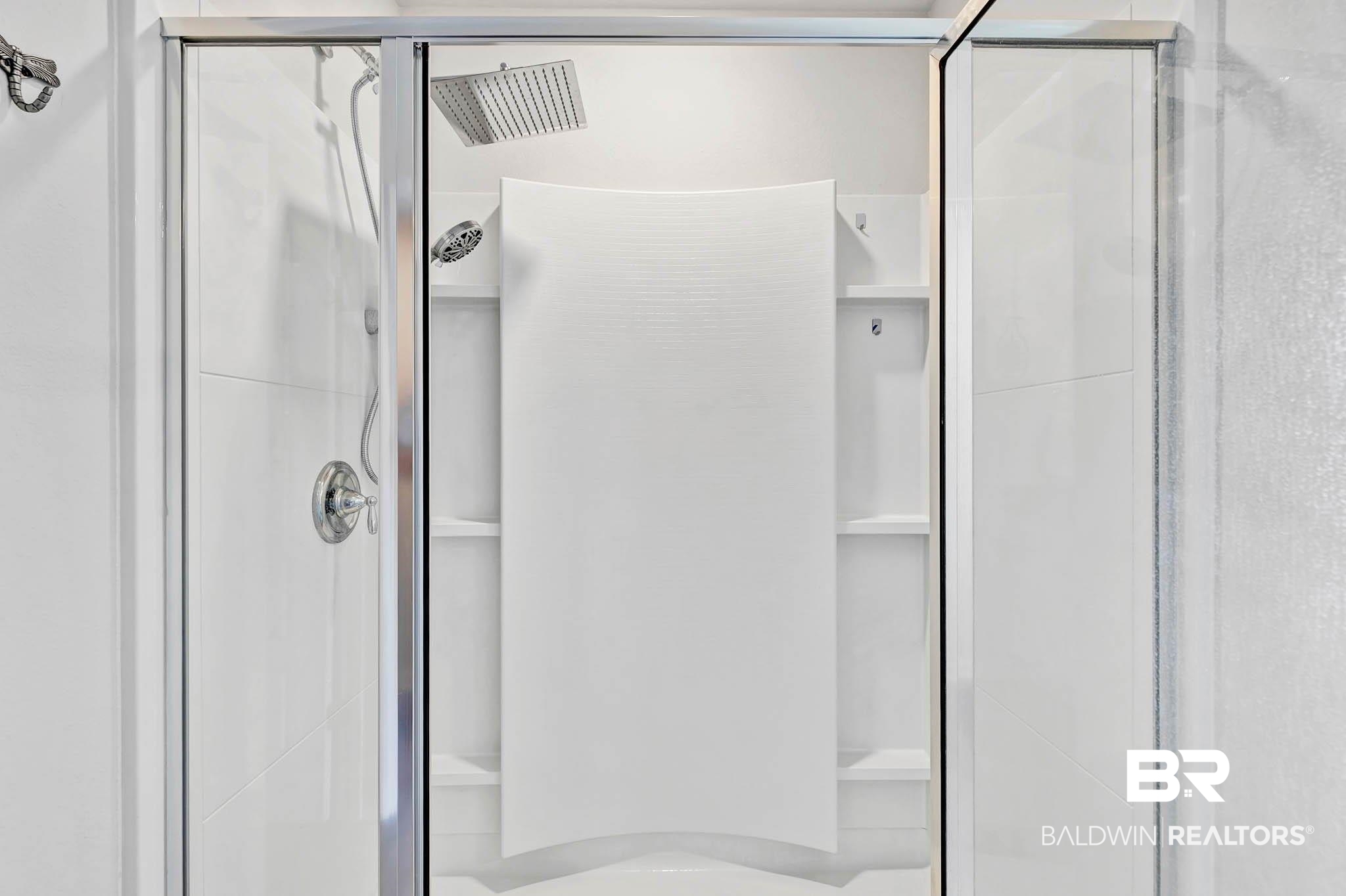 17217 REFLECTION Street Loxley, AL 36551 - Photo 26 of 83 Primary En Suite Bathroom featuring a spacious closet, double vanity, a garden tub, a stall shower, with an upgraded shower head and lvp flooring.