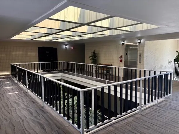 a view of balcony with wooden floor