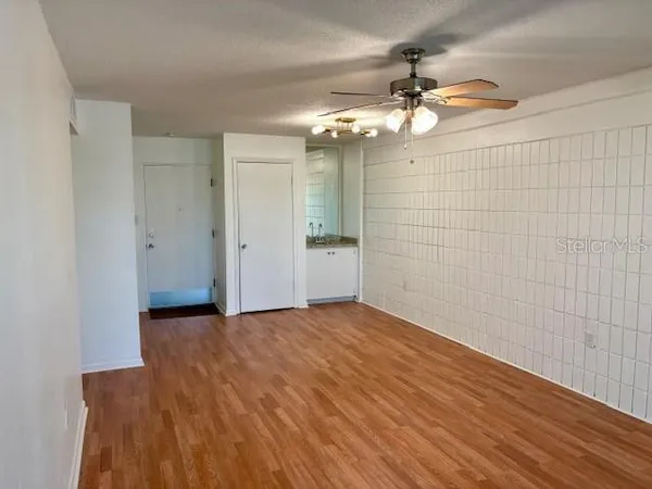 a view of an empty room with a window