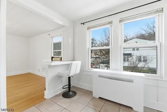 a bathroom with a sink mirror toilet and bathtub