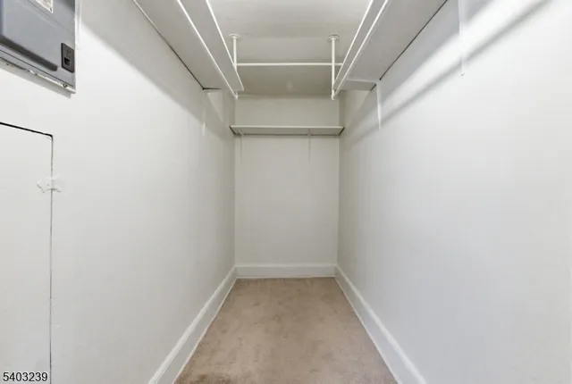 a living room with furniture a flat screen tv and a window