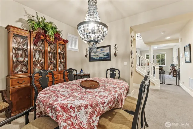 a bedroom with furniture and a chandelier