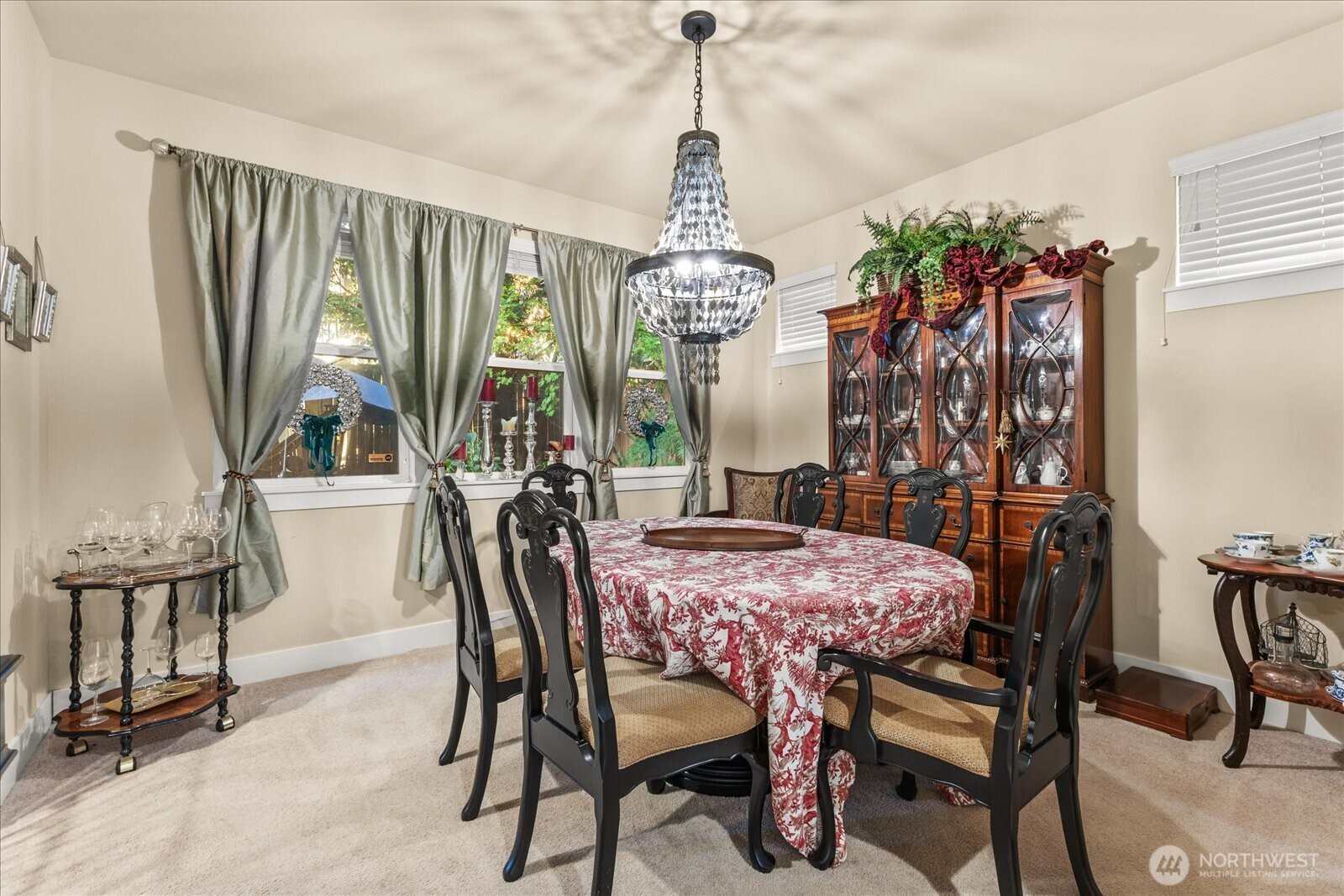 3611 232nd Street Southeast Bothell, WA 98021 - Photo 11 of 28 a view of a dining room with furniture and a chandelier