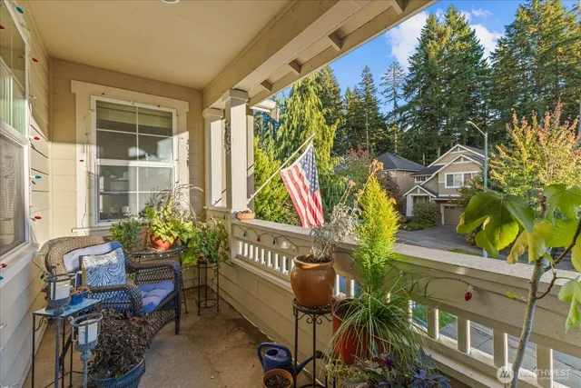 a view of a patio with table and chairs and potted plants