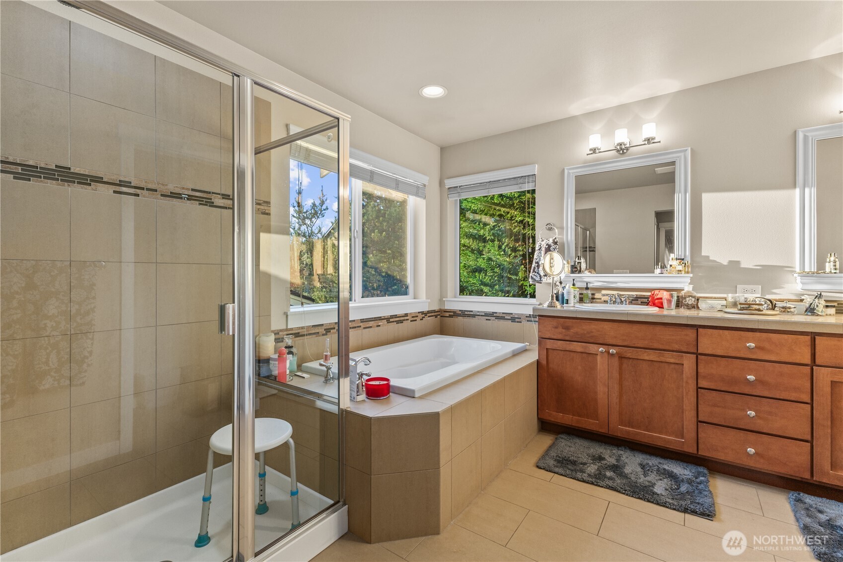 3611 232nd Street Southeast Bothell, WA 98021 - Photo 19 of 29 a bathroom with a tub sink and mirror