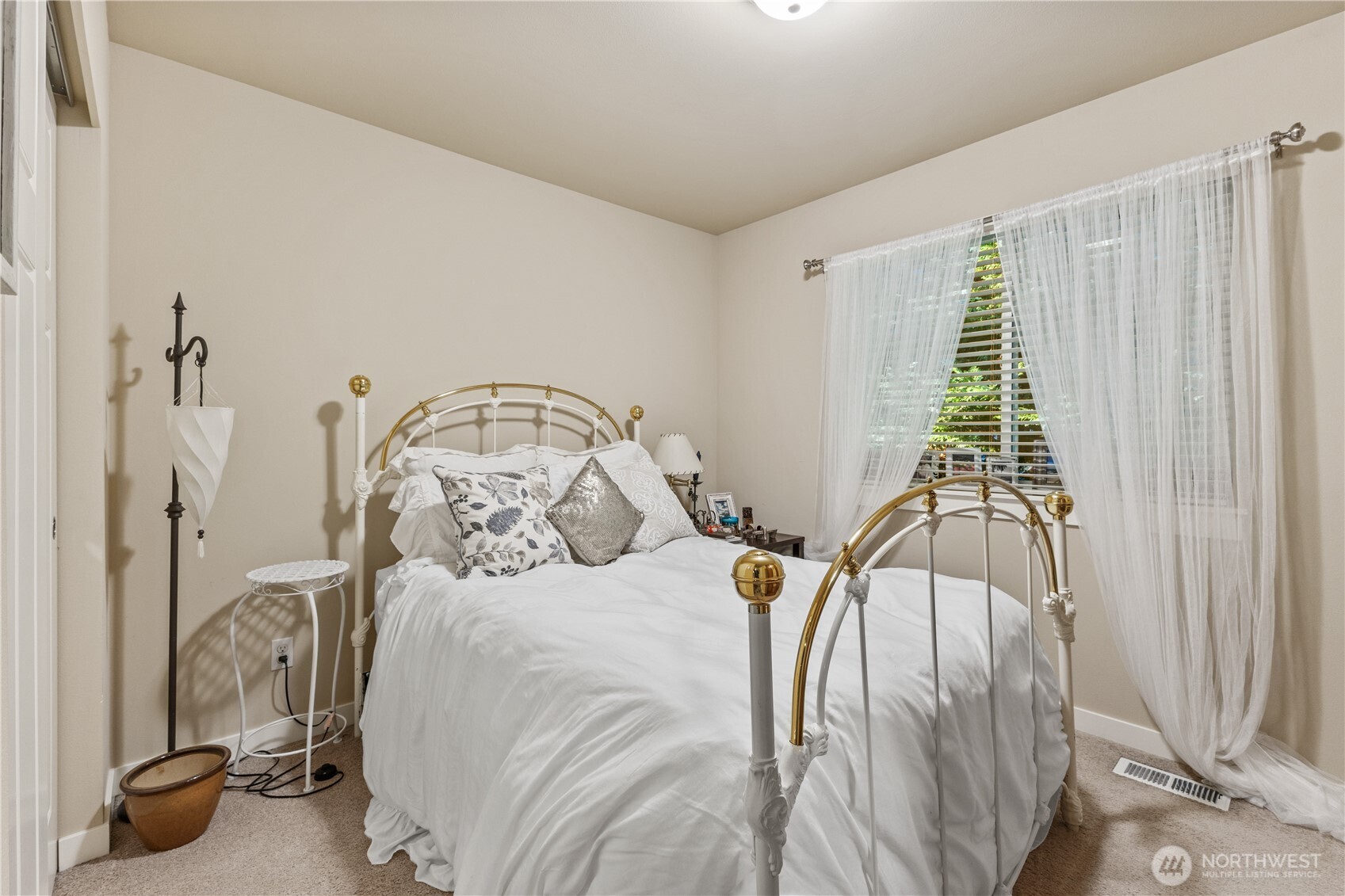 3611 232nd Street Southeast Bothell, WA 98021 - Photo 20 of 29 a bedroom with a bed and a chandelier