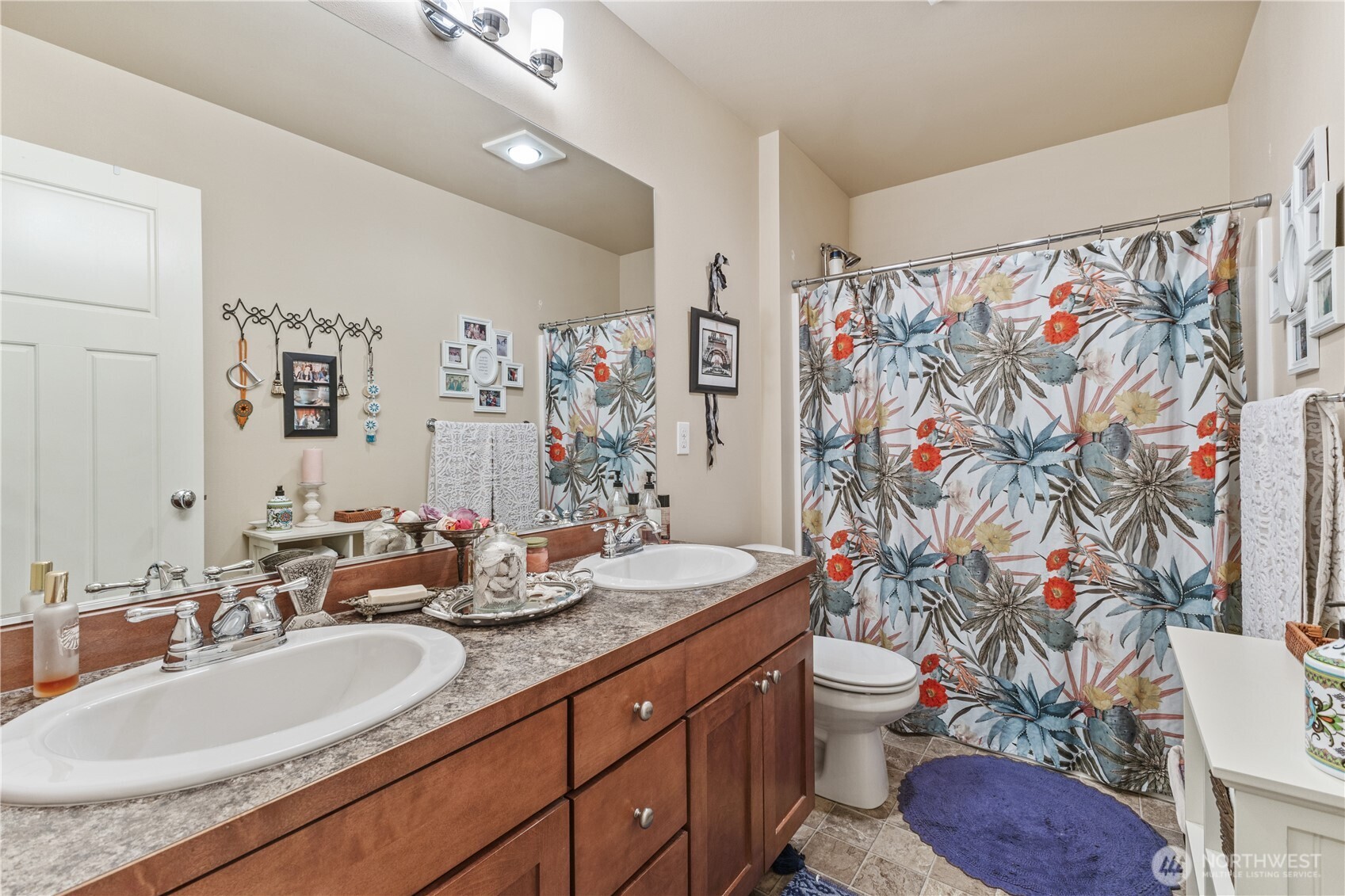 3611 232nd Street Southeast Bothell, WA 98021 - Photo 22 of 29 a bathroom with a granite countertop sink and a mirror with toilet