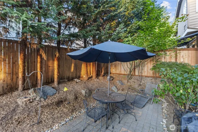 a view of a city with lush green forest