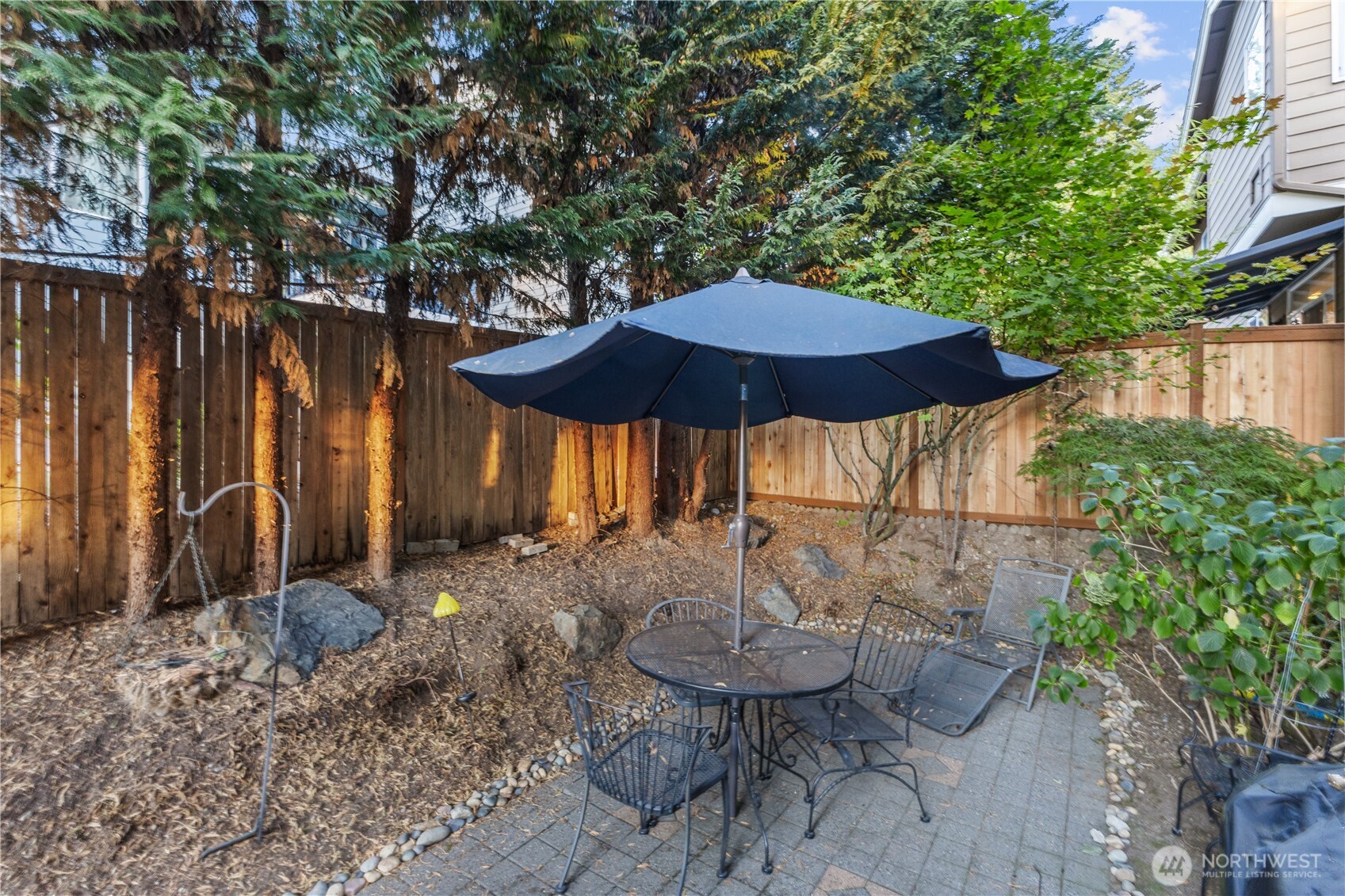 3611 232nd Street Southeast Bothell, WA 98021 - Photo 26 of 29 a backyard of a house with table and chairs