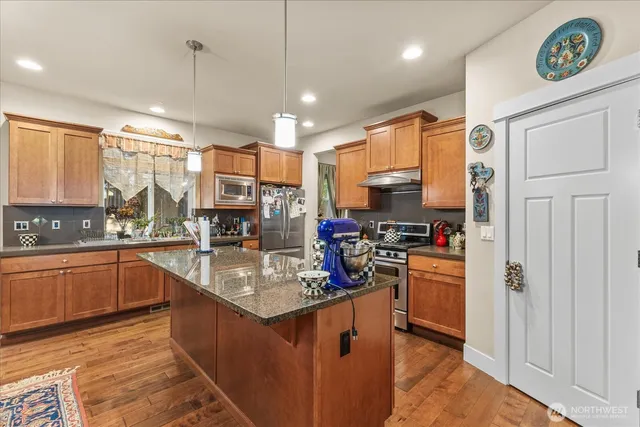a kitchen with granite countertop lots of counter top space