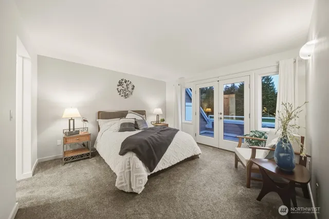 a bed room with a bed and a chair