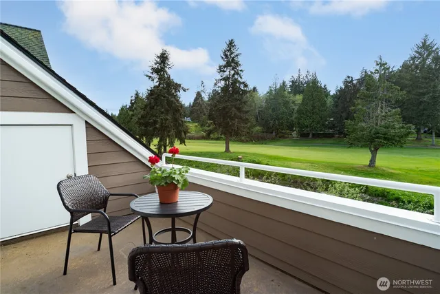 a view of a chairs and table in the patio