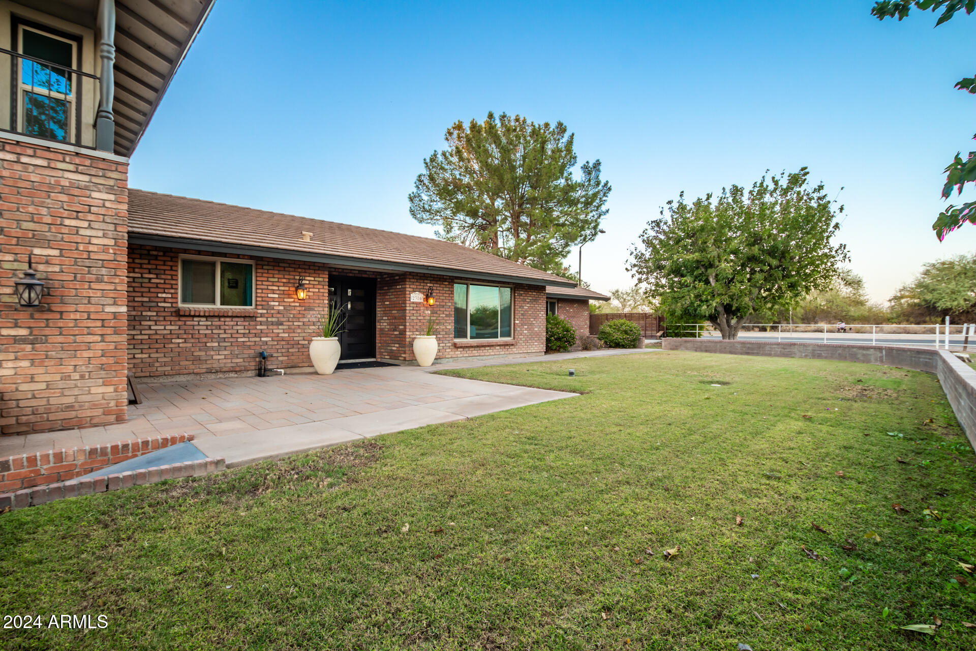 2386 East Redfield Road Gilbert, AZ 85234 - Photo 102 of 107 a front view of a house with a yard