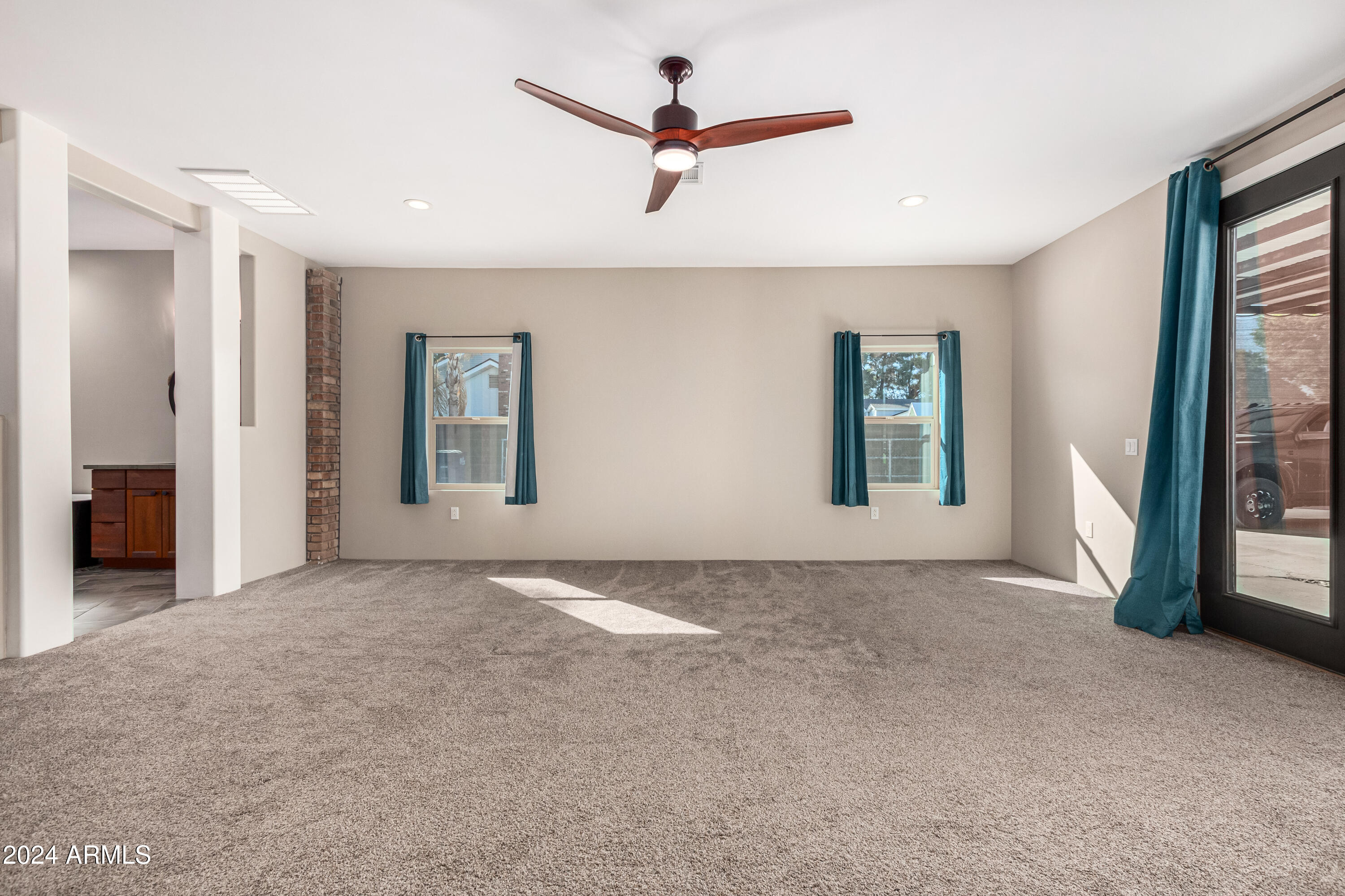 2386 East Redfield Road Gilbert, AZ 85234 - Photo 26 of 107 an empty room with window and a ceiling fan