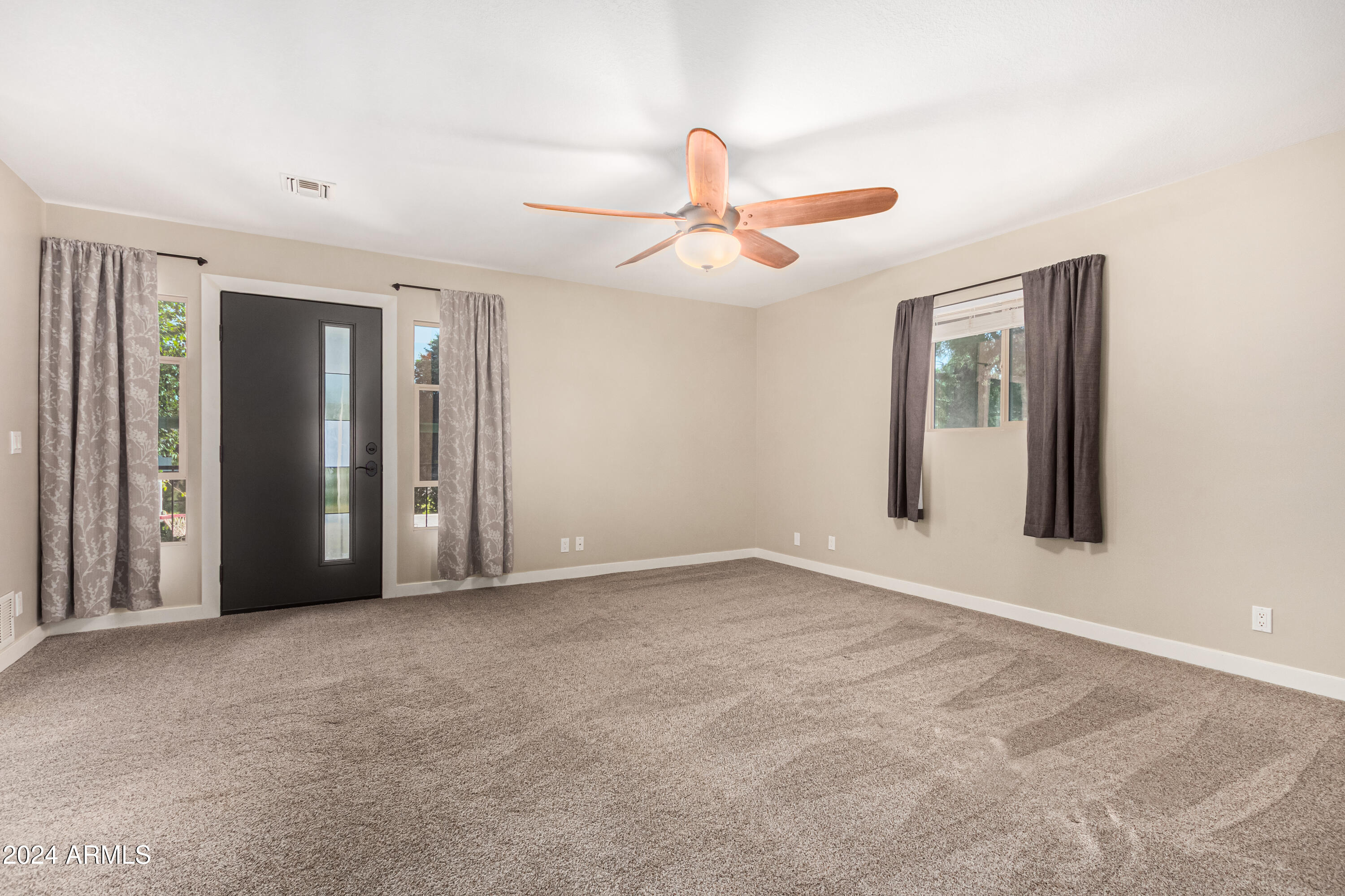 2386 East Redfield Road Gilbert, AZ 85234 - Photo 42 of 107 a view of an empty room with a ceiling fan