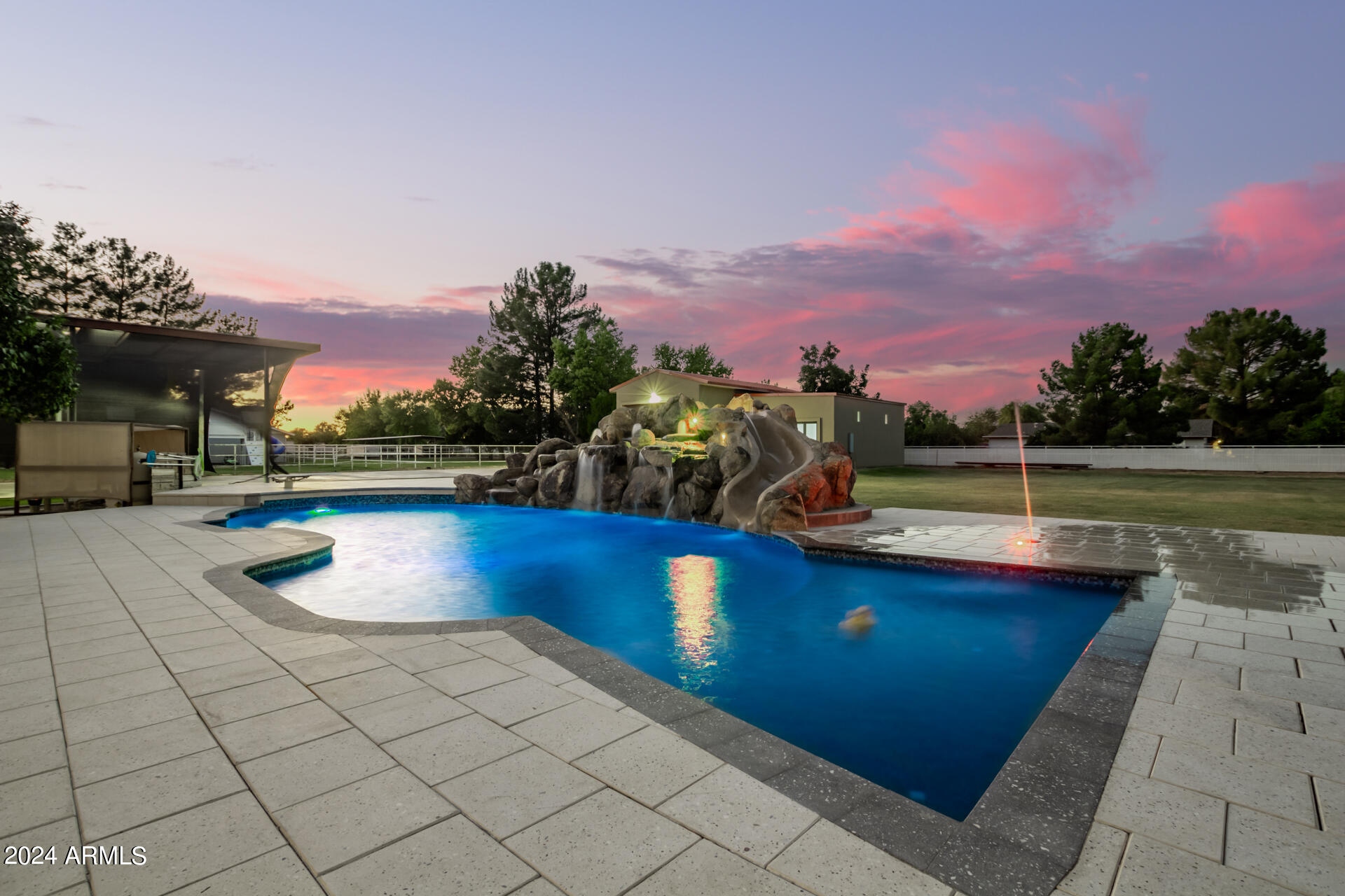 2386 East Redfield Road Gilbert, AZ 85234 - Photo 47 of 107 a view of a swimming pool with a lounge chairs