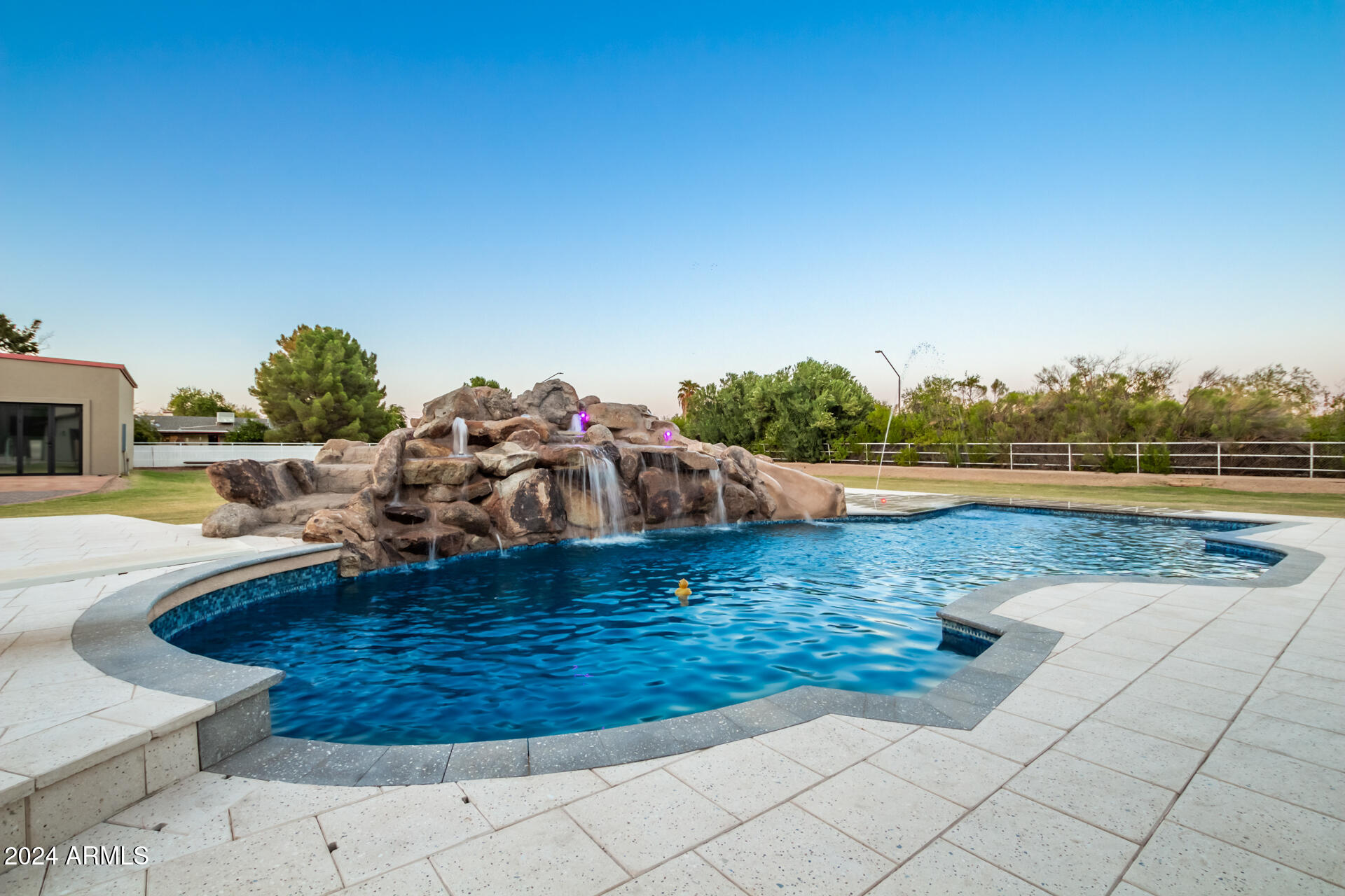 2386 East Redfield Road Gilbert, AZ 85234 - Photo 49 of 107 a view of a swimming pool with an ocean