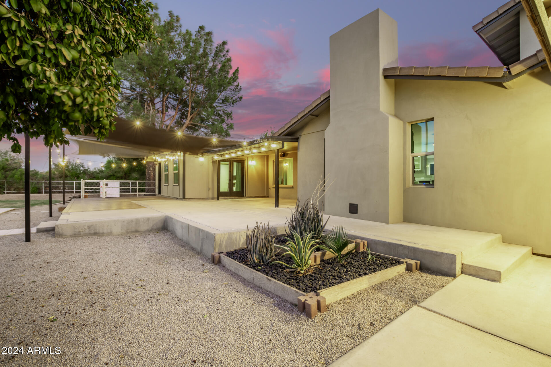 2386 East Redfield Road Gilbert, AZ 85234 - Photo 52 of 107 a front view of a house with a garden