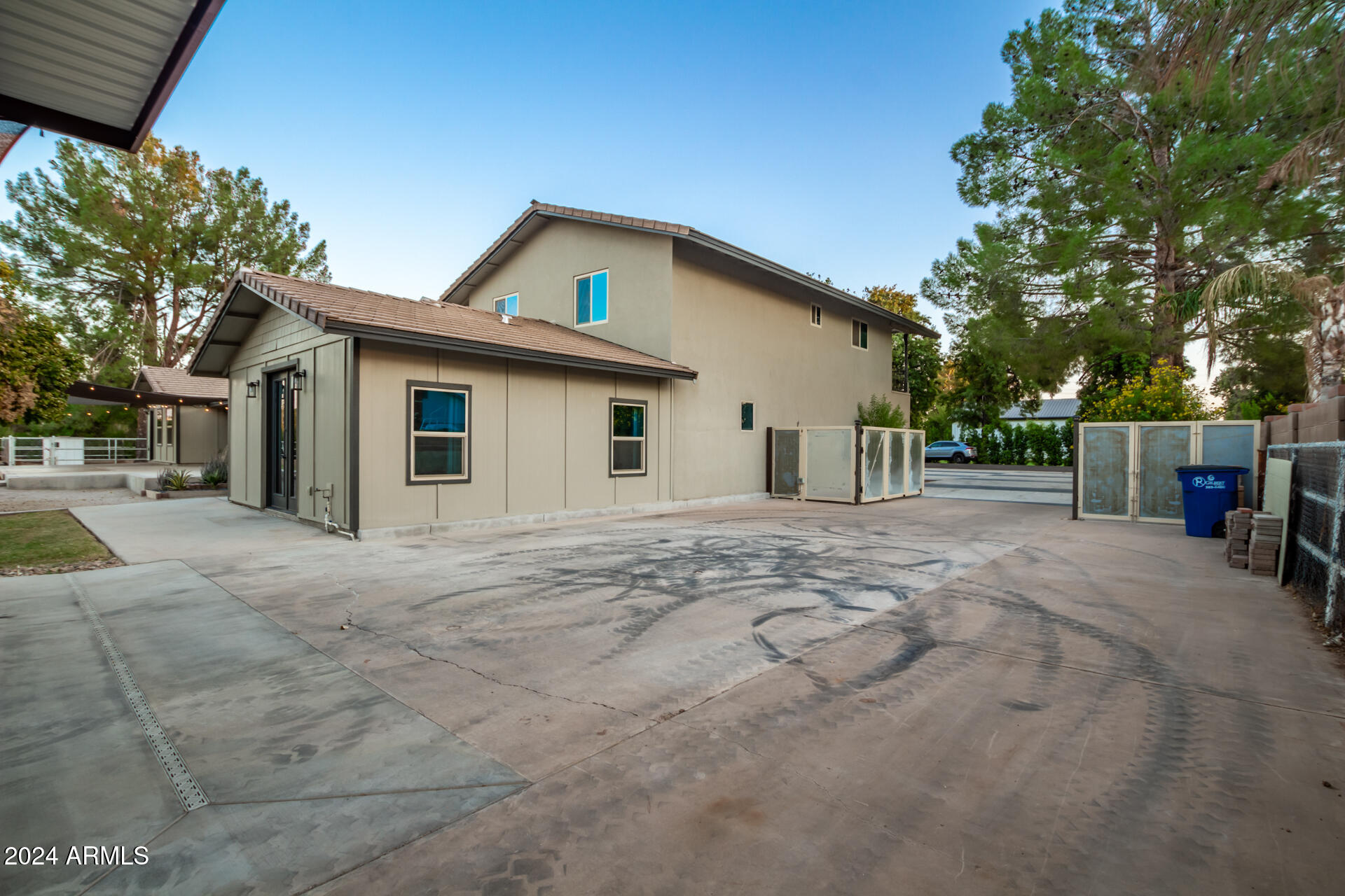2386 East Redfield Road Gilbert, AZ 85234 - Photo 64 of 107 a view of a white house with a yard and large tree