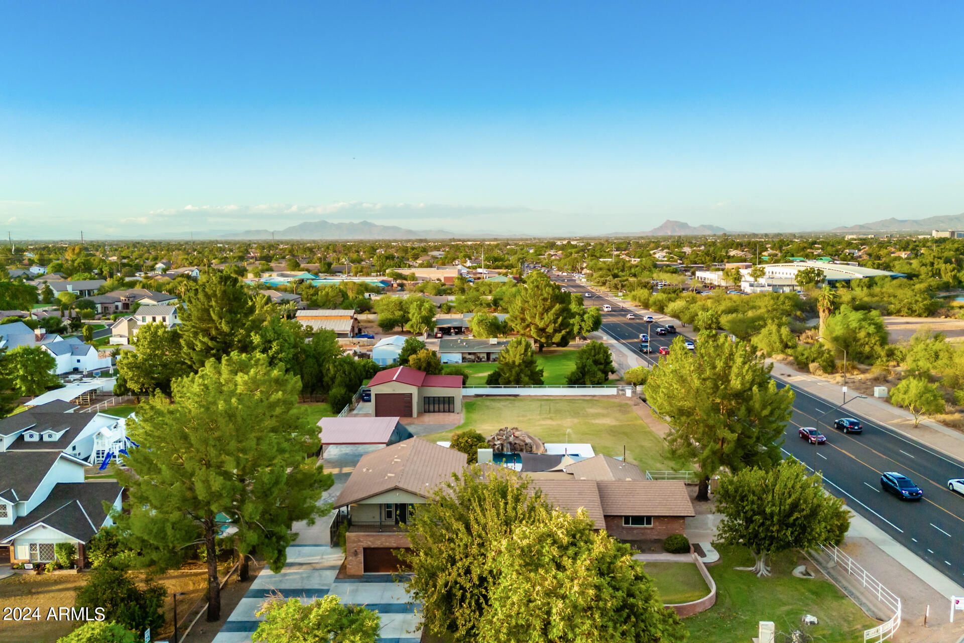 2386 East Redfield Road Gilbert, AZ 85234 - Photo 84 of 107 an aerial view of residential houses with outdoor space