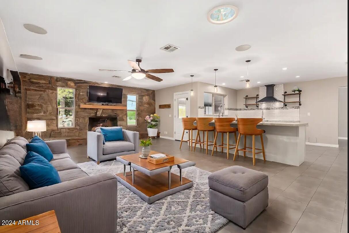2386 East Redfield Road Gilbert, AZ 85234 - Photo 8 of 107 a living room with furniture kitchen view and a chandelier