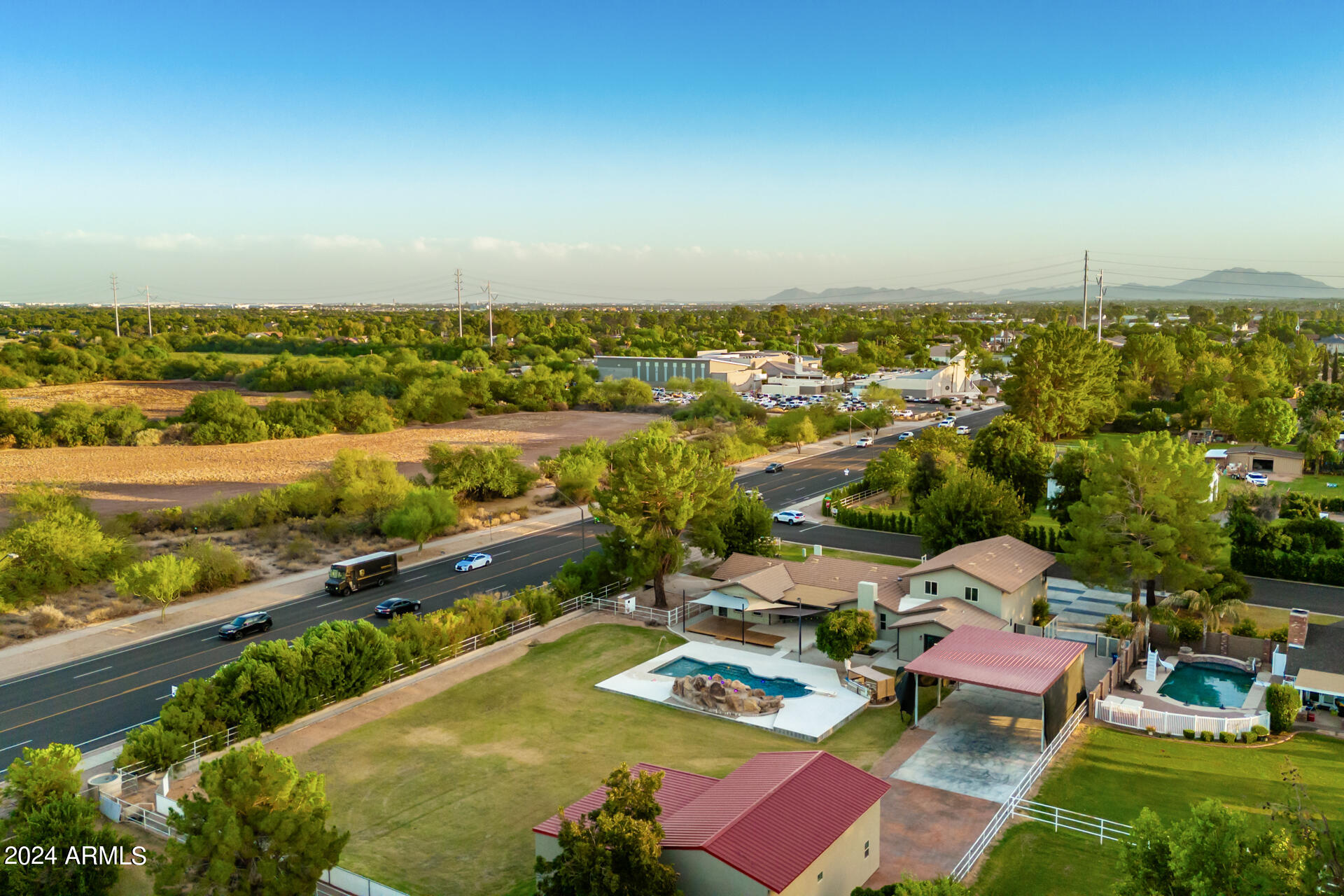 2386 East Redfield Road Gilbert, AZ 85234 - Photo 90 of 107 an aerial view of residential houses with outdoor space