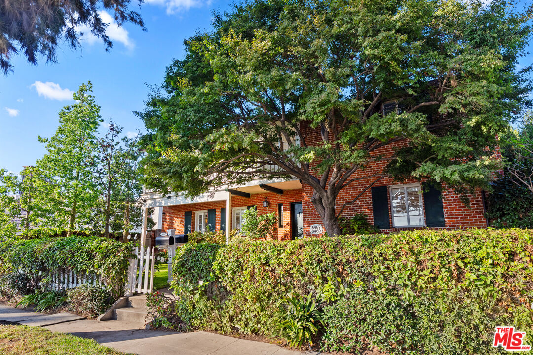 8467 West 4th Street Los Angeles, CA 90048 - Photo 12 of 12 a front view of a house with garden