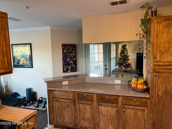 a view of a kitchen area with furniture and window
