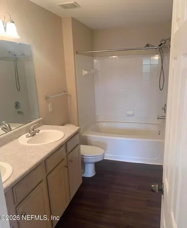 a bathroom with a sink toilet tub and shower