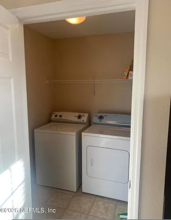 a utility room with dryer and washer