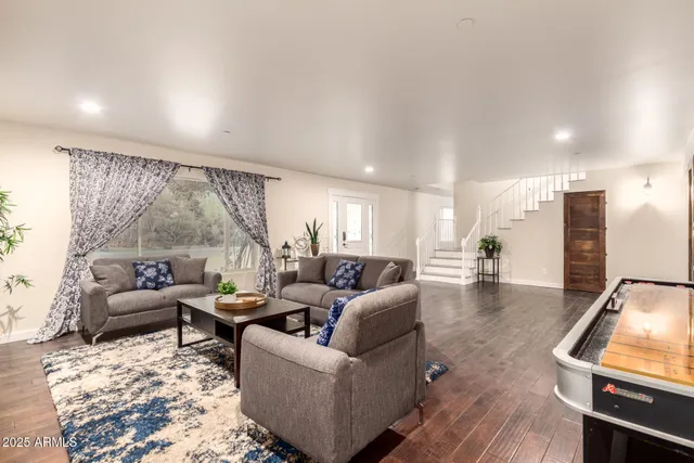 a view of a dining room with furniture wooden floor and chandelier