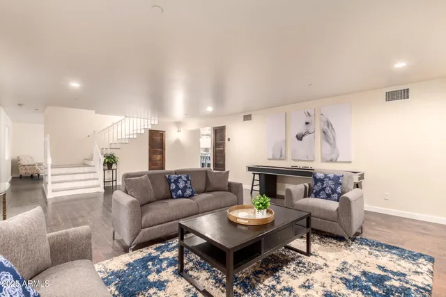 a view of a dining room with furniture and wooden floor