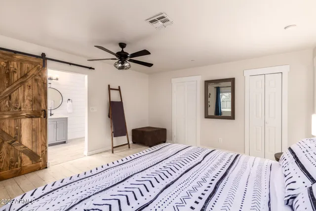 a bathroom with a toilet a sink and a mirror