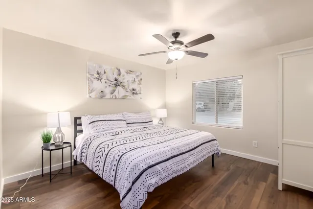 a bedroom with a large bed and a window