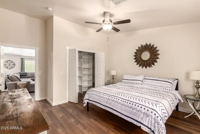 a view of a livingroom with furniture and a window