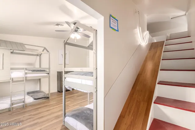 a bathroom with a sink vanity mirror and toilet
