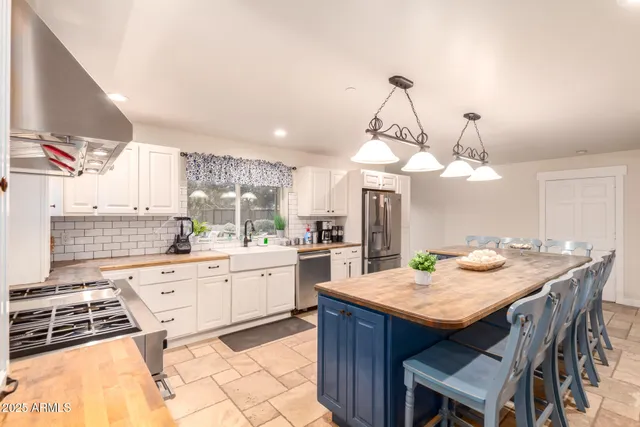 a bathroom with a double vanity sink mirror and shower