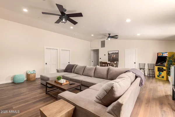 a kitchen with stainless steel appliances granite countertop a sink and a refrigerator