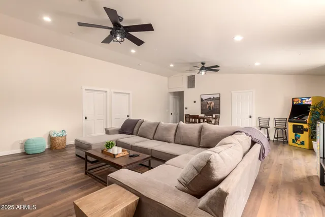 a kitchen with stainless steel appliances granite countertop a sink and a refrigerator