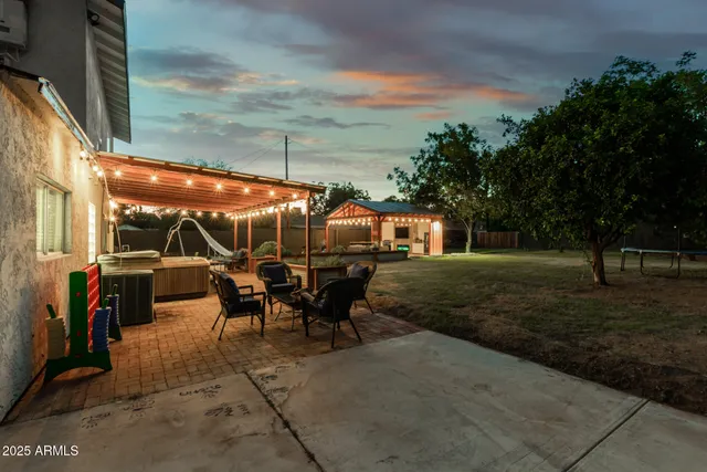 a view of a swimming pool with furniture