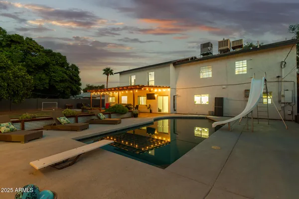 a view of a swimming pool with a patio