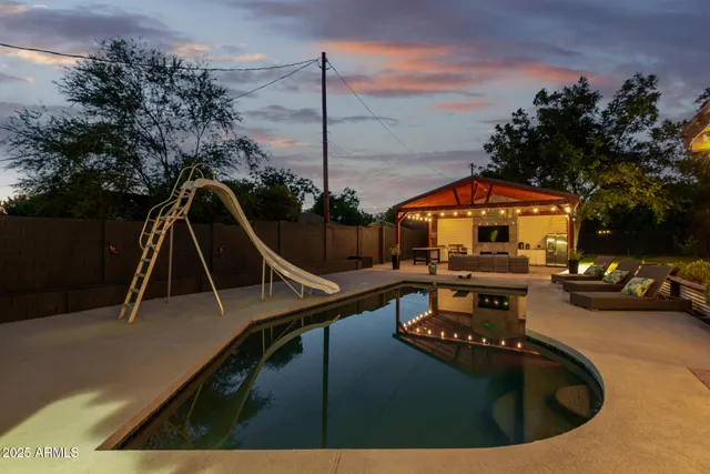 a view of a swimming pool with a patio