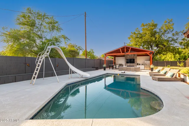 a view of kitchen with furniture and large windows