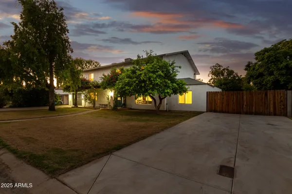 a view of a swimming pool with a house in the background