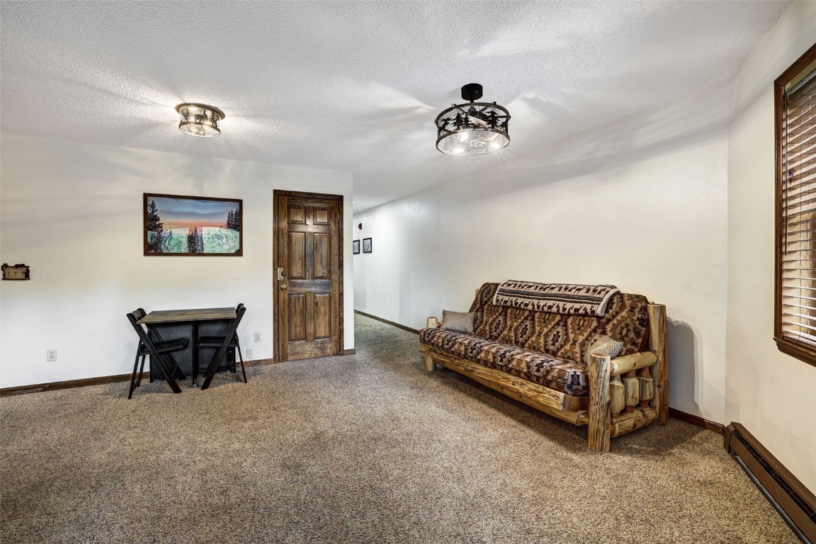 840 4 O Clock Road, Unit A1D Breckenridge, CO 80424 - Photo 12 of 38 a living room with furniture