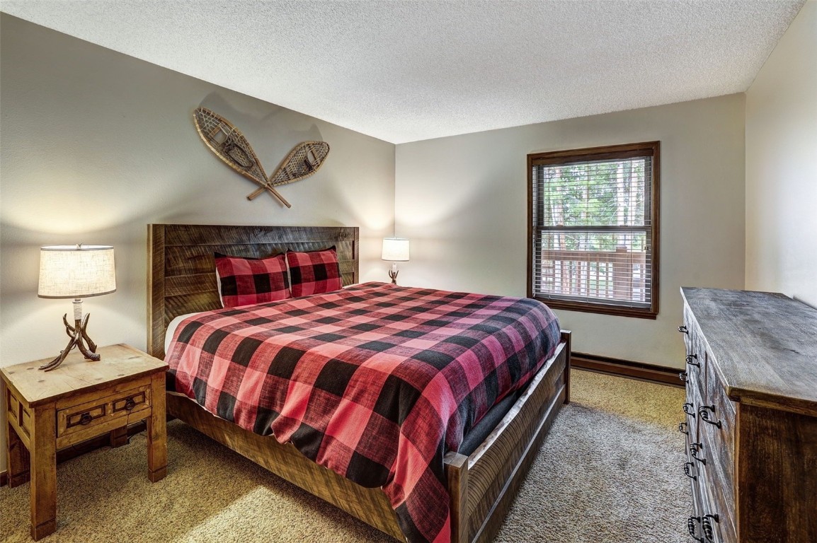840 4 O Clock Road, Unit A1D Breckenridge, CO 80424 - Photo 16 of 38 a bedroom with a bed and window
